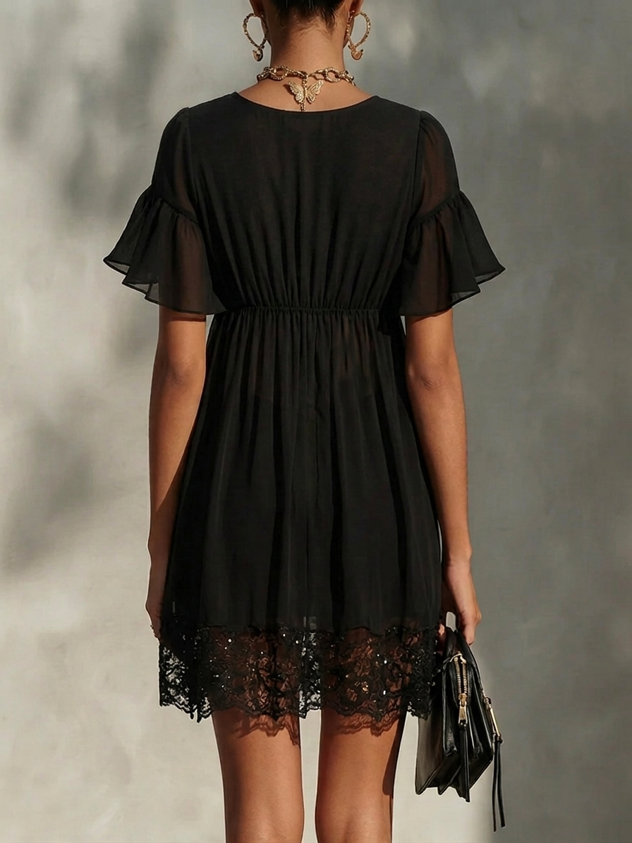 Rachele | Miniabito nero in chiffon con cremallera dorata e orlo in pizzo